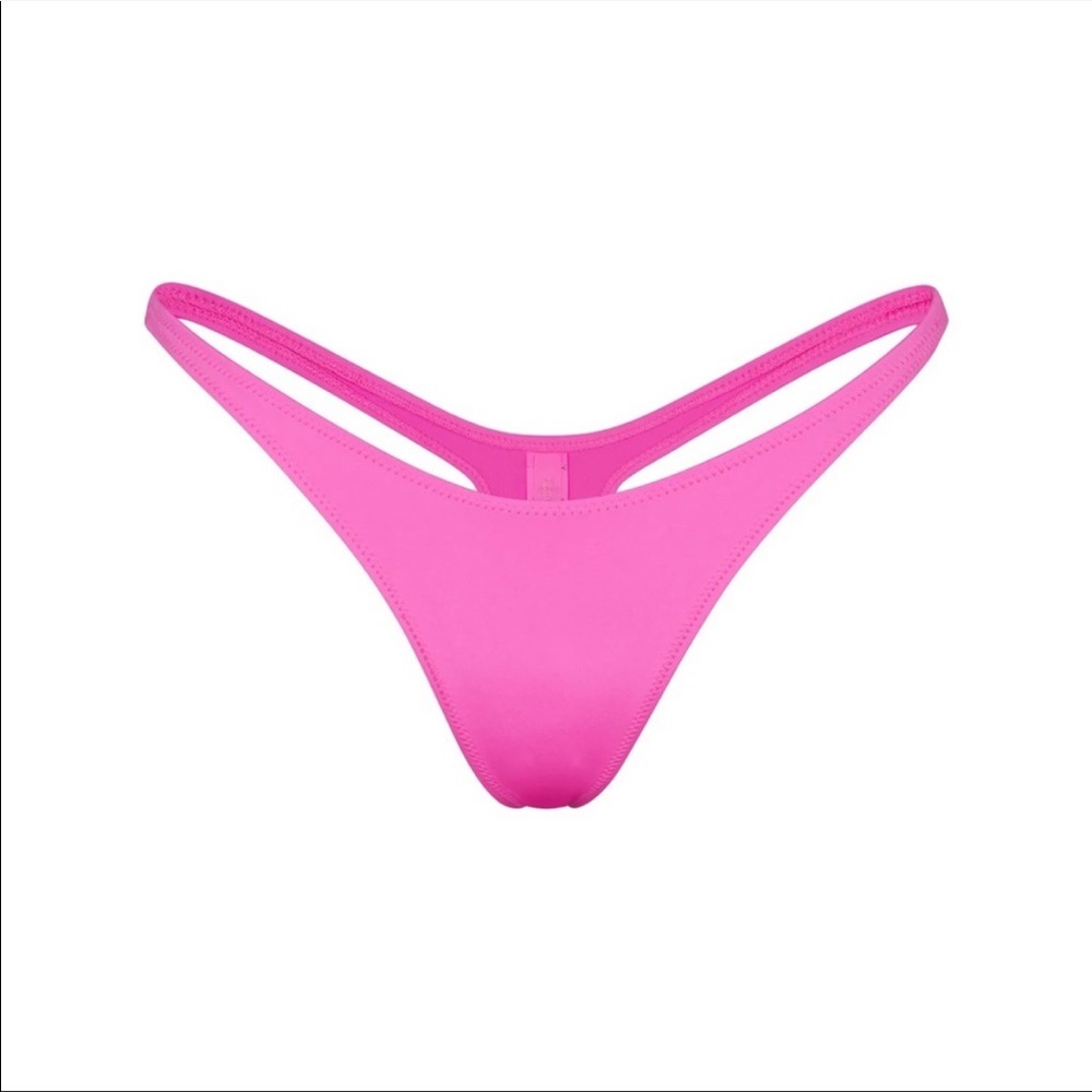 Skims swim thong in taffy